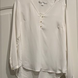 100%polyester; longer length in back;darts.